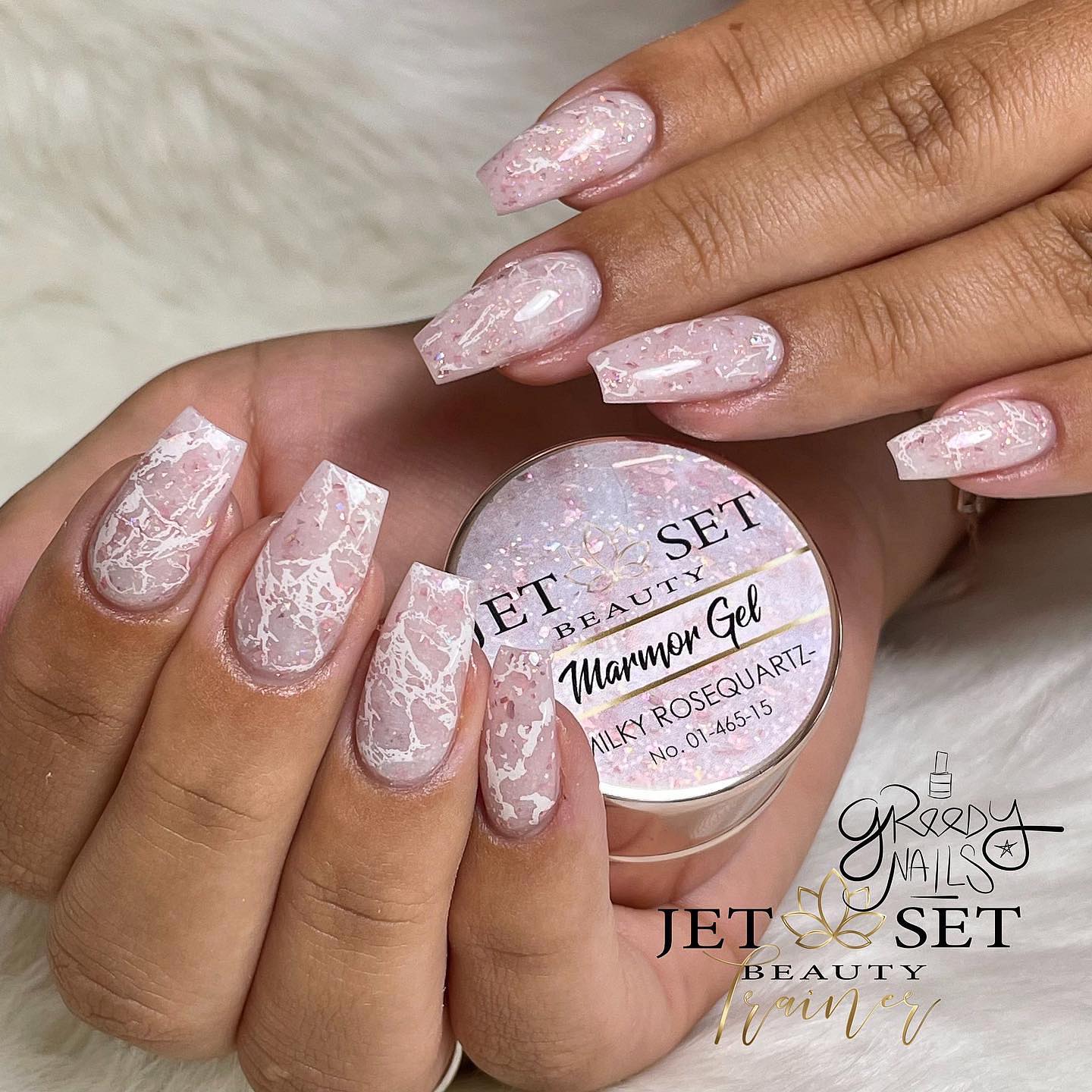 Nude Manicure with White Marble Design on Coffin Nails