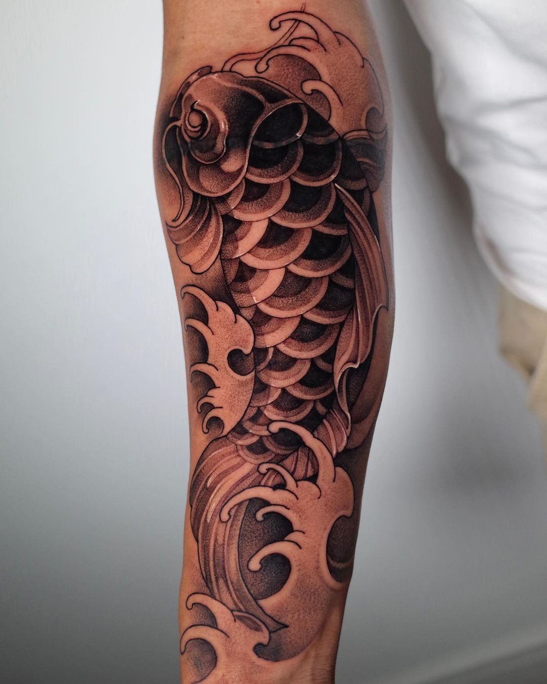 Black and White Japanese Koi Fish Tattoo on Arm