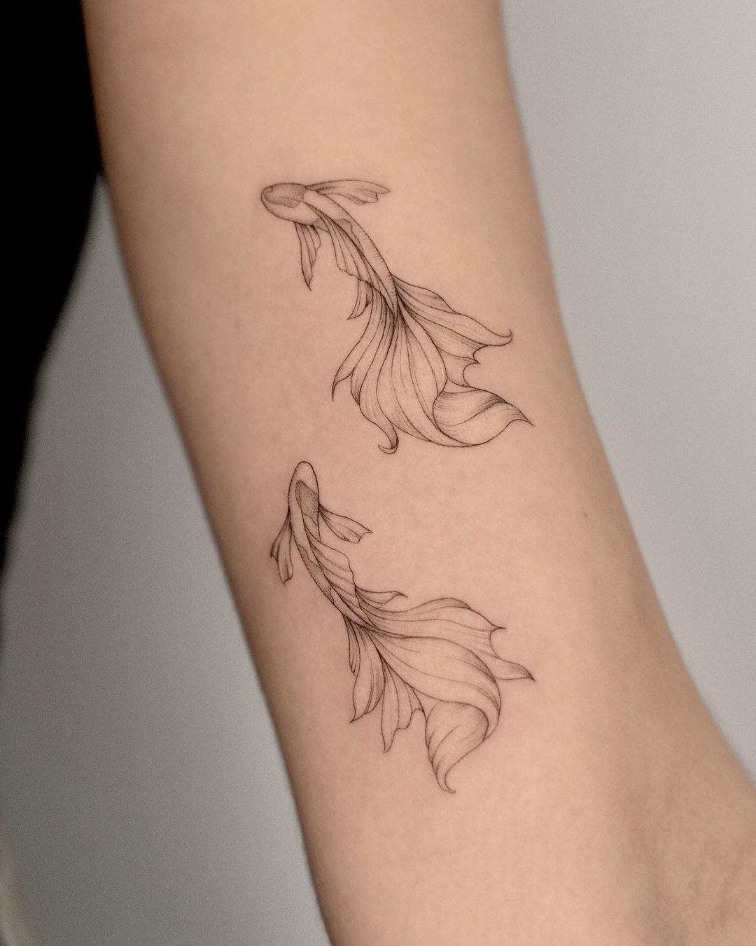 Small Koi Fish Tattoo on Arm