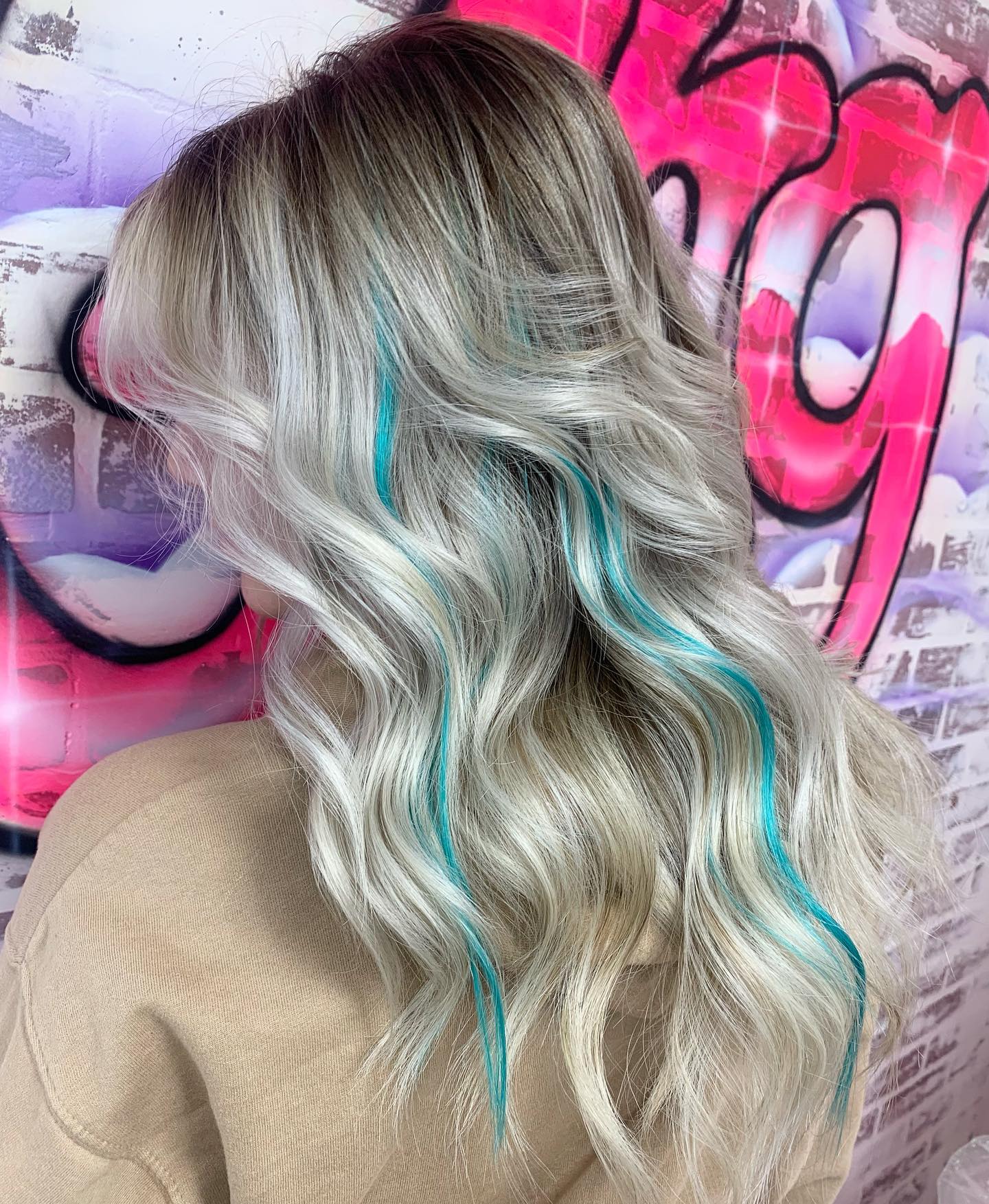 Turquoise Highlights on Long Wavy Blonde Hair