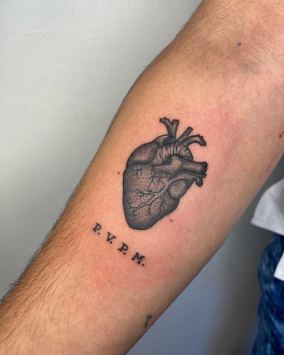 Black 3D Heart Tattoo on Arm