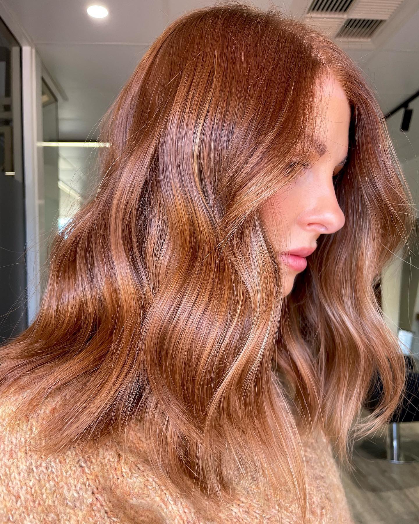 Medium Length Ginger Hair with Golden Rose Hues