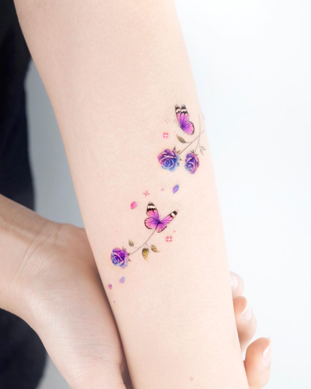 Small Light Purple Butterfly Tattoo