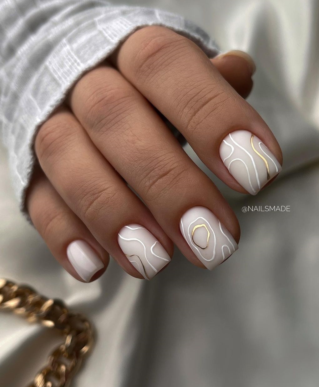 Short Matte White Nails with White and Gold Swirls