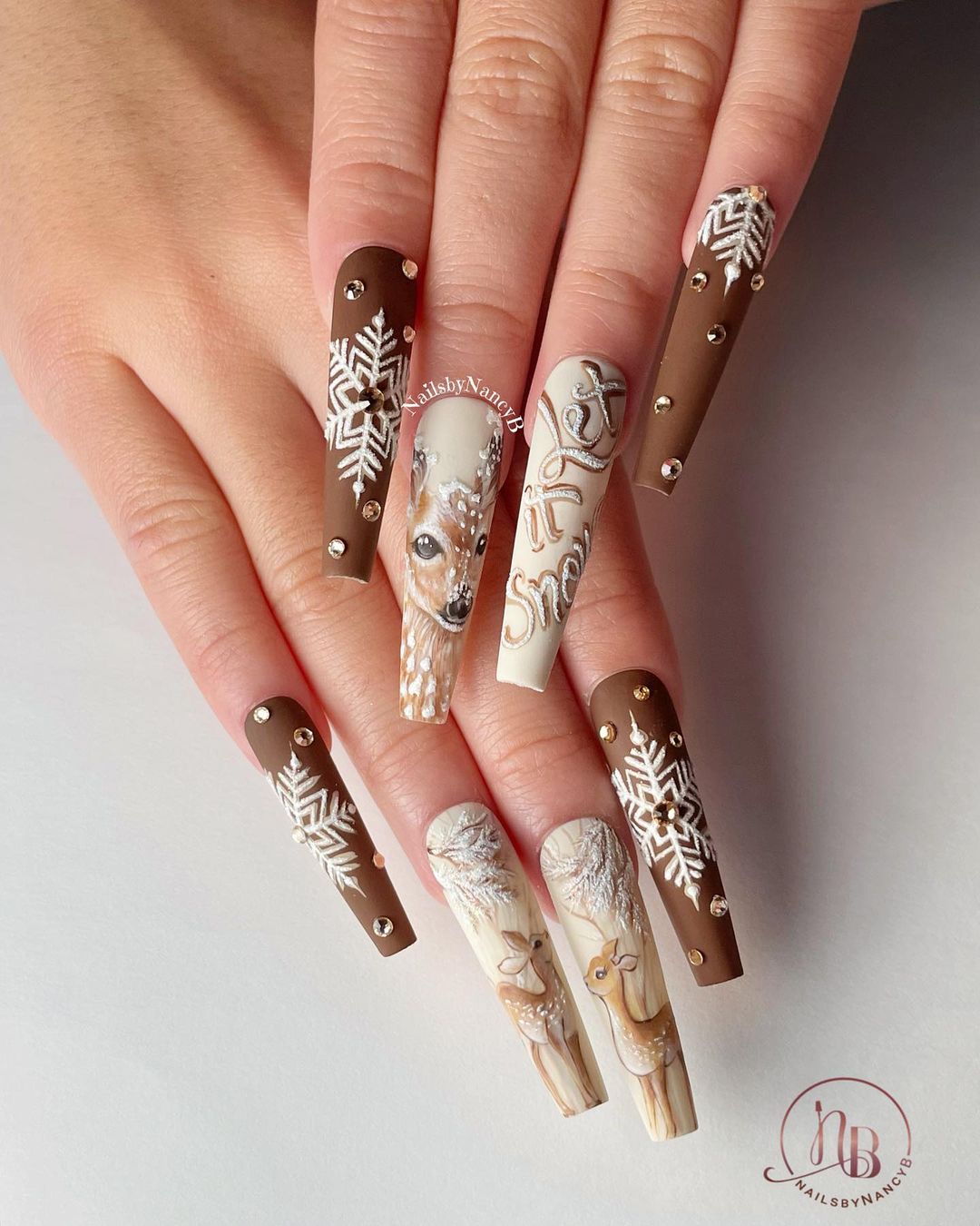 Long Brown Nails with White Snowflakes and Reindeer