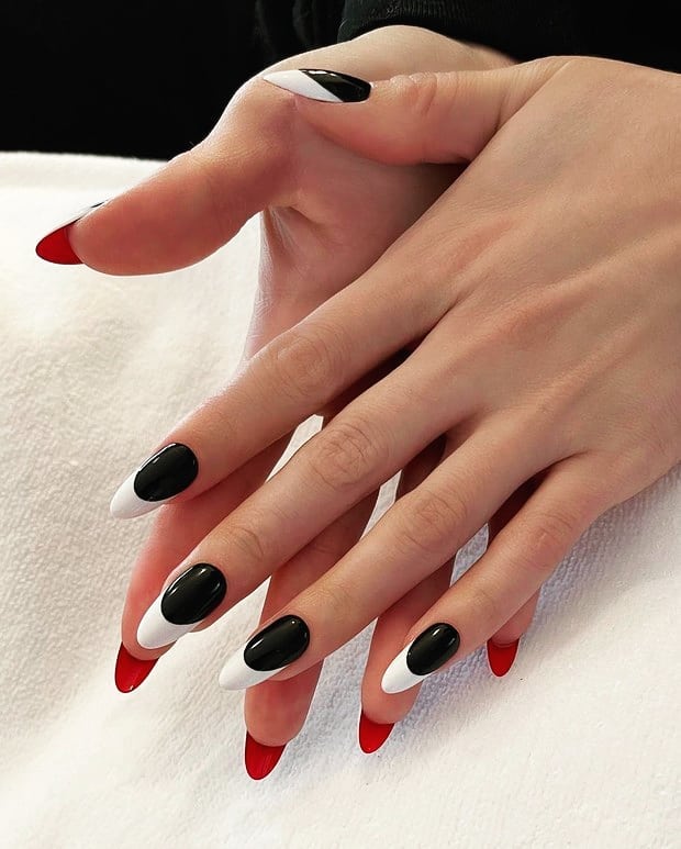 Glossy Black Nails with White Tips and Red Bottoms