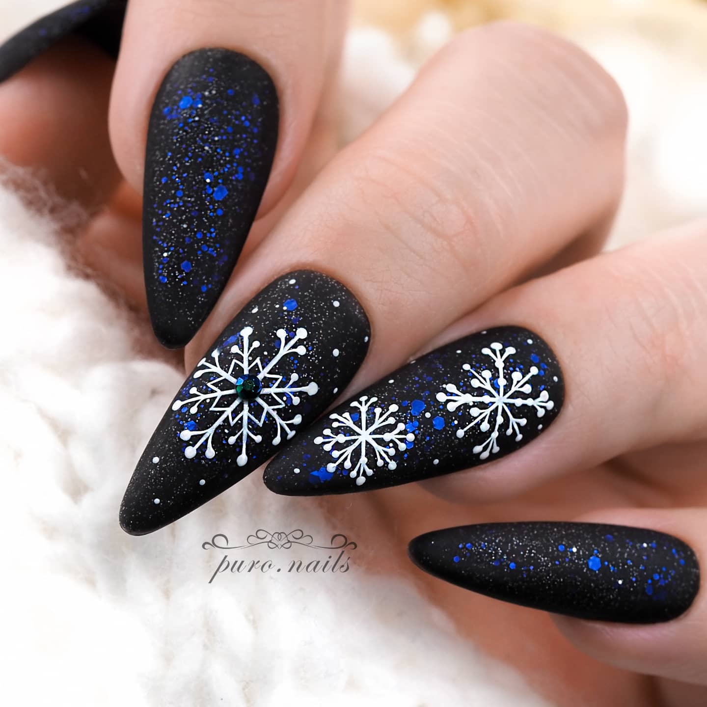 Black Nails with Blue Glitter and Snowflakes