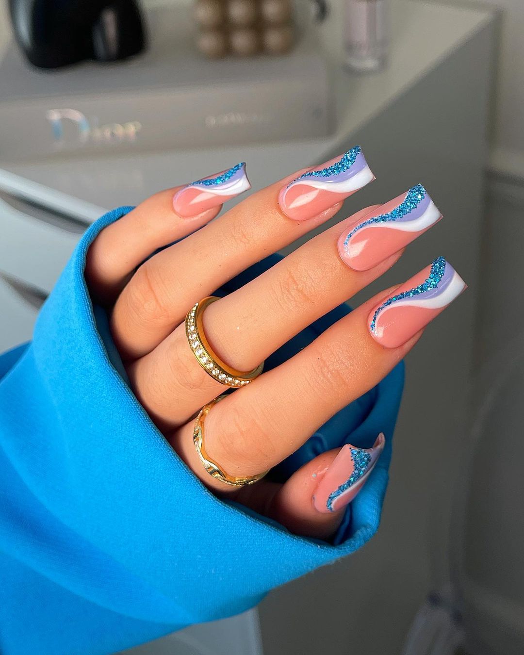 Square Nude Nails with Blue Swirl Design