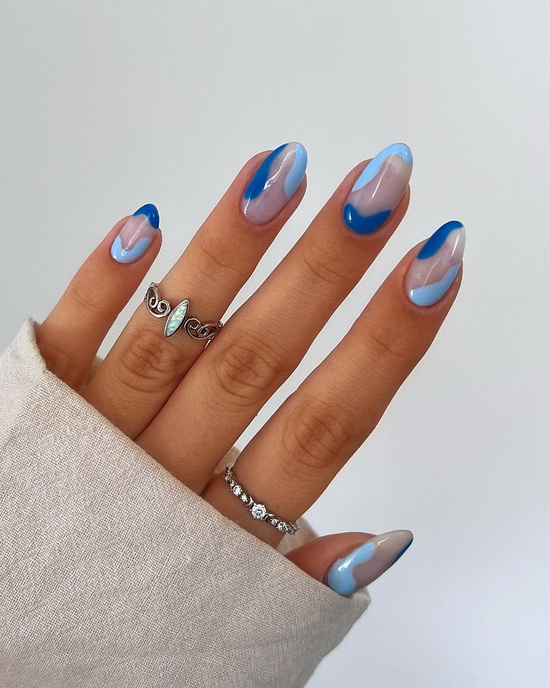 Short Round Nails with Blue Swirls