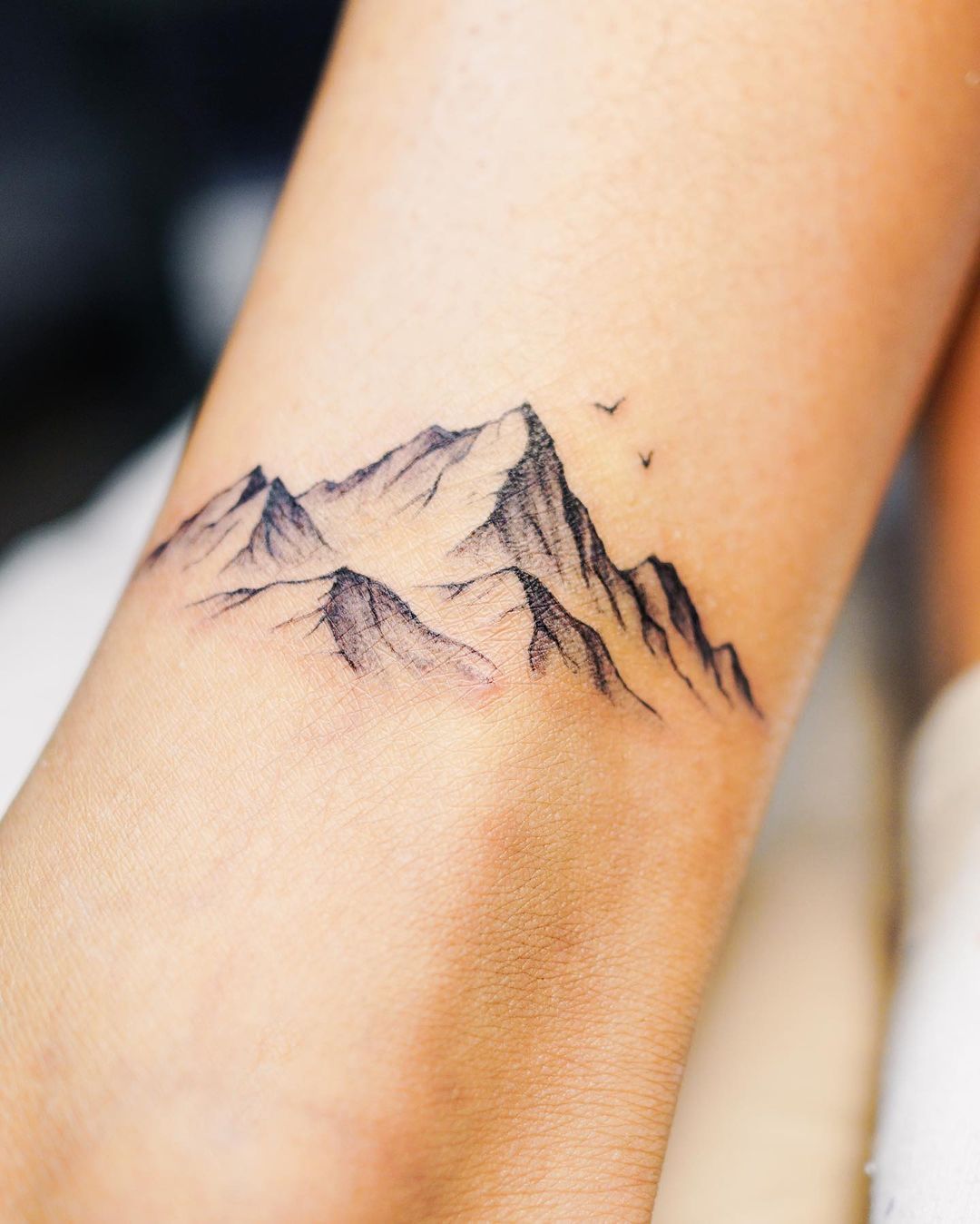 Minimalist mountain range tattoo by Chinatown Stropky - Tattoogrid.net